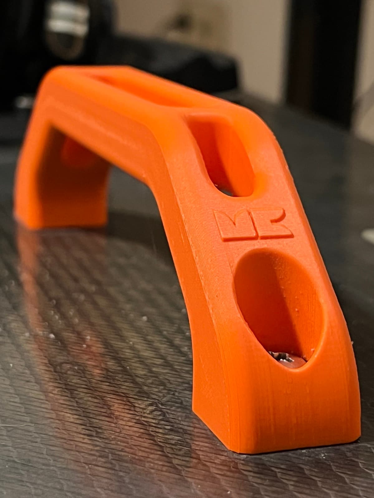 Four PETG prototypes printed in different colors