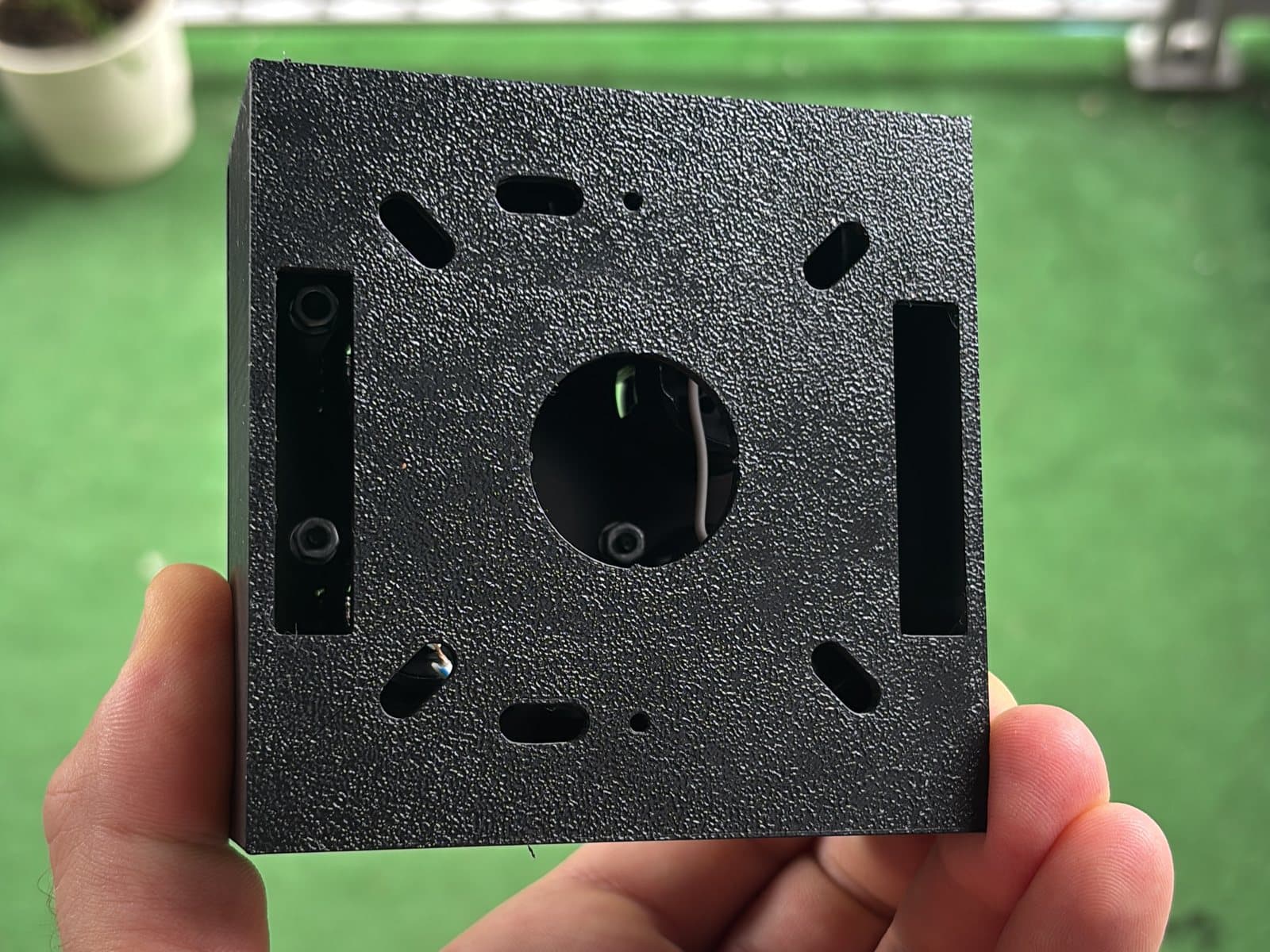 The first prototype from the open side: the hole pattern in the base, bosses without inserts yet.