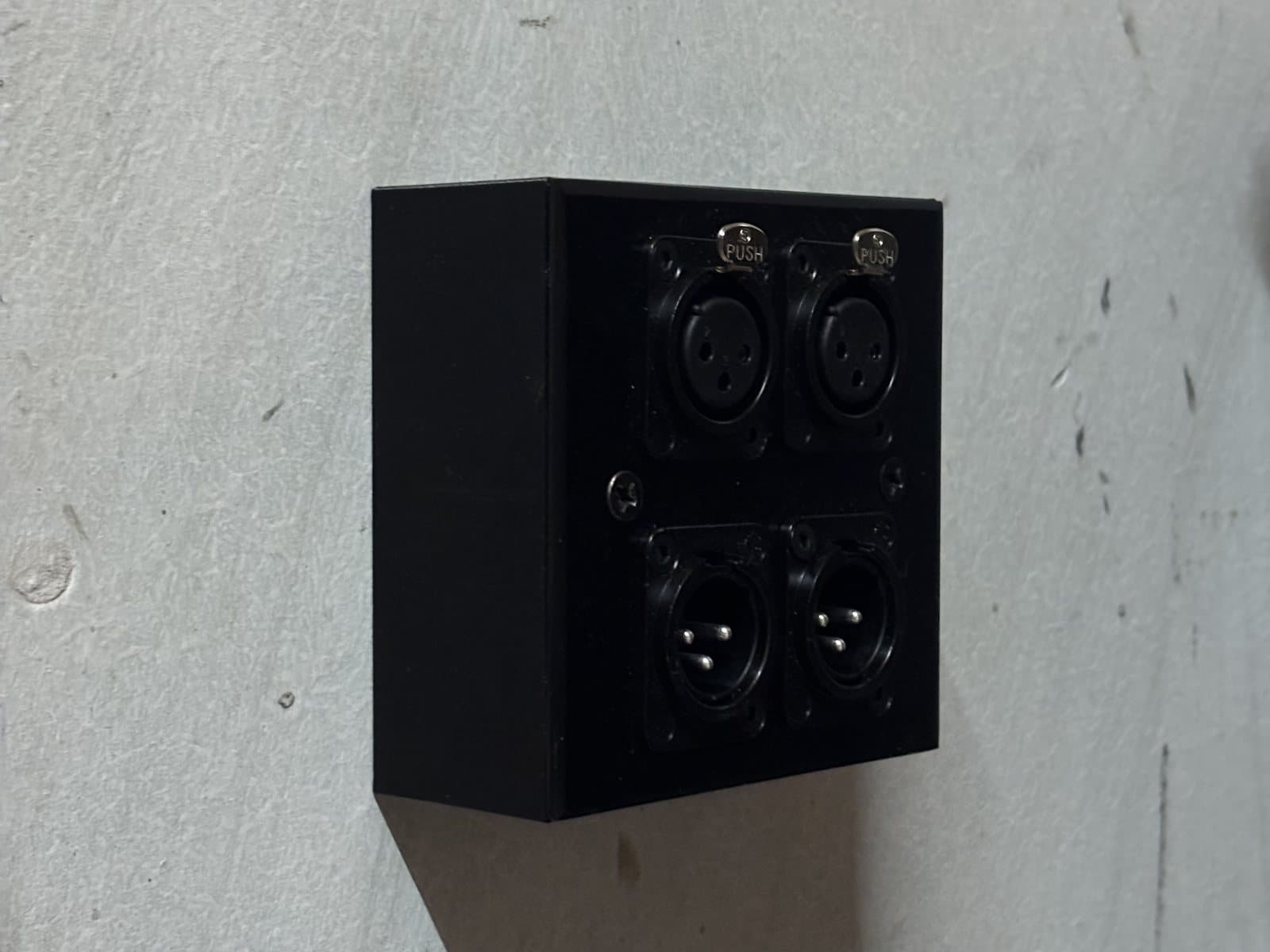 The box installed in the studio: plate on two screws, cable in from the side.